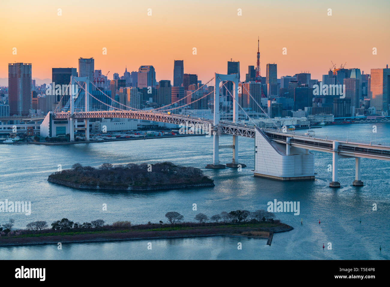Rainbow Bridge And Tokyo Tower During Sunset Time In Odaiba Japan