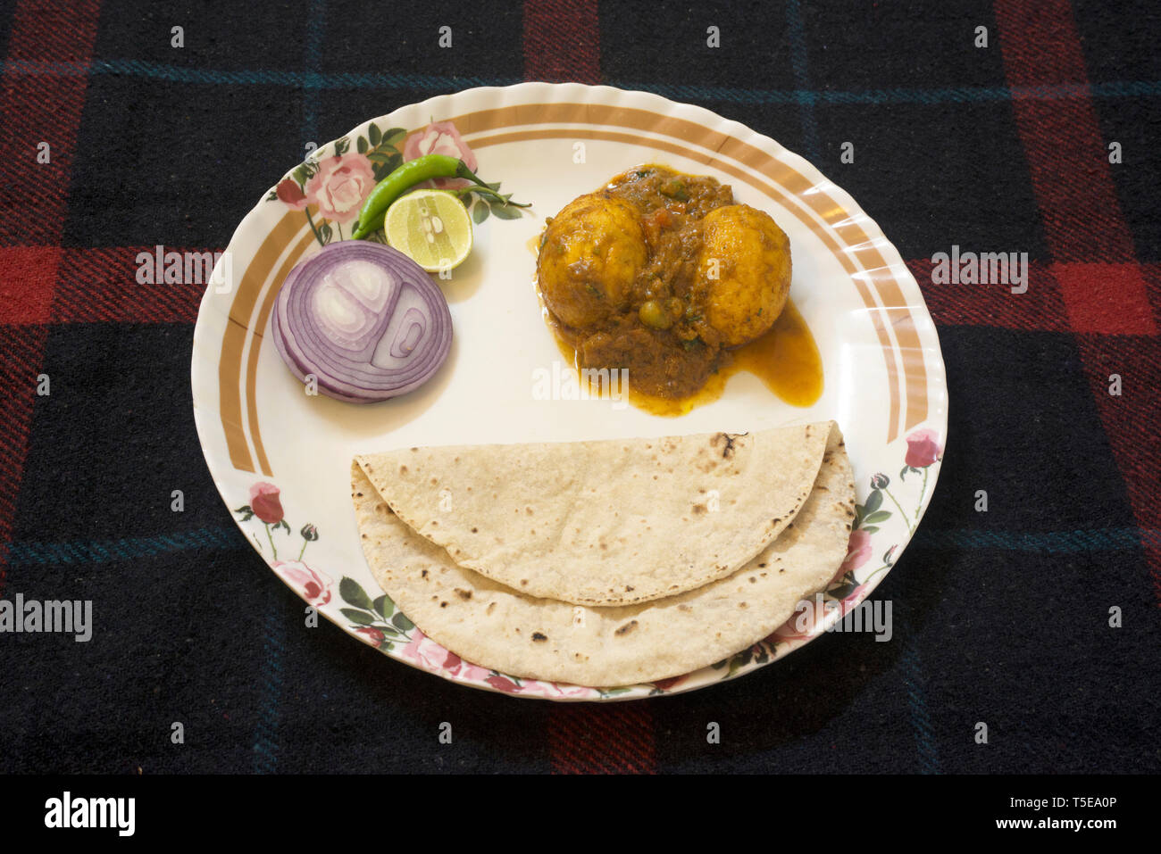 Indian food Egg Curry and Chapati served in plate, bhubaneswar, odisha
