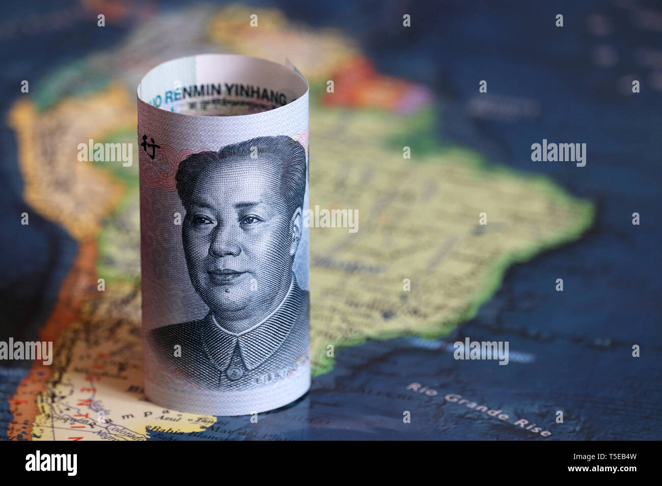 Chinese yuan on the map of South America. Trading between China and Latin American countries, economy and investment Stock Photo