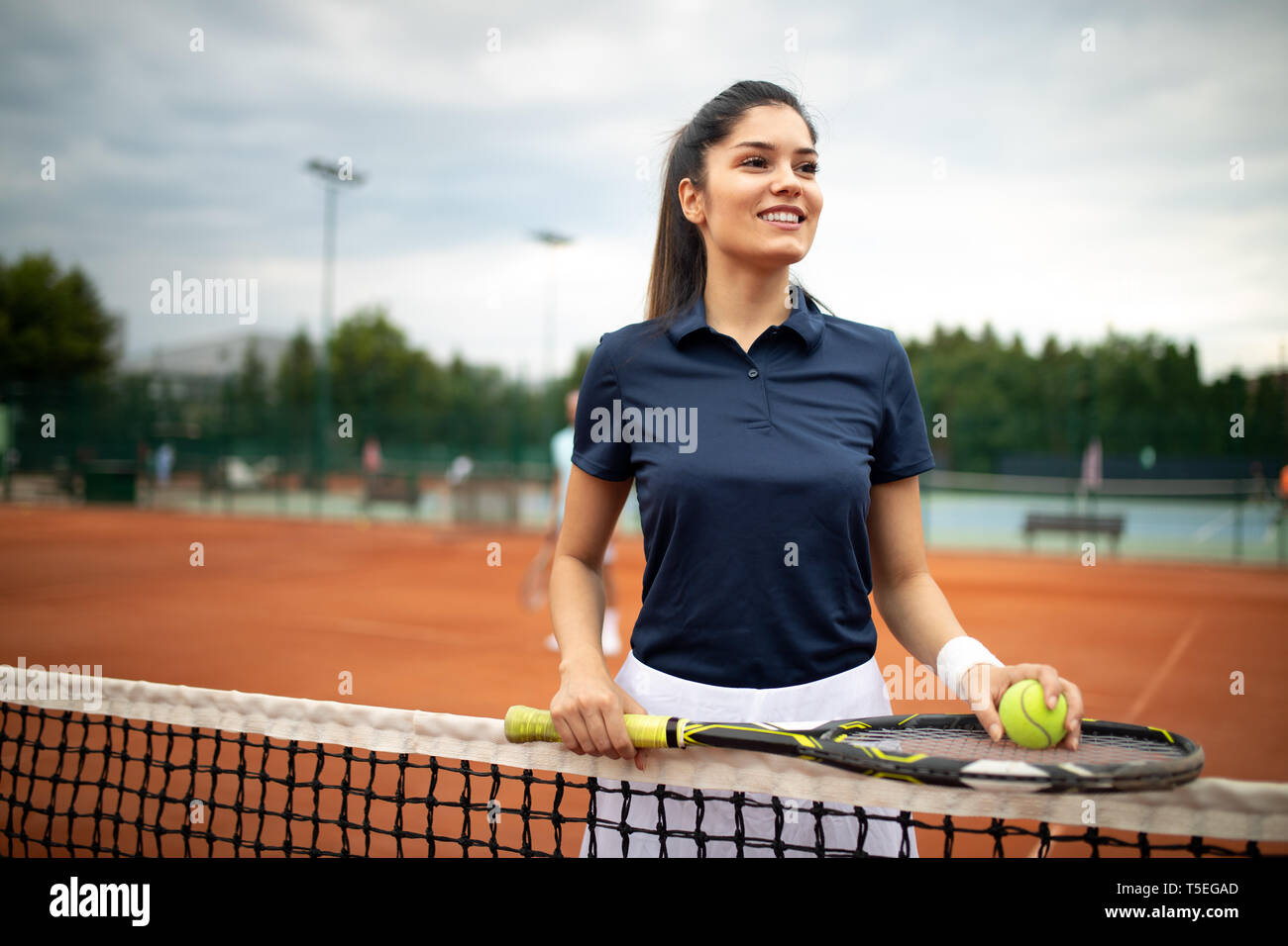 Happy fit girl playing tennis together. Sport concept Stock Photo