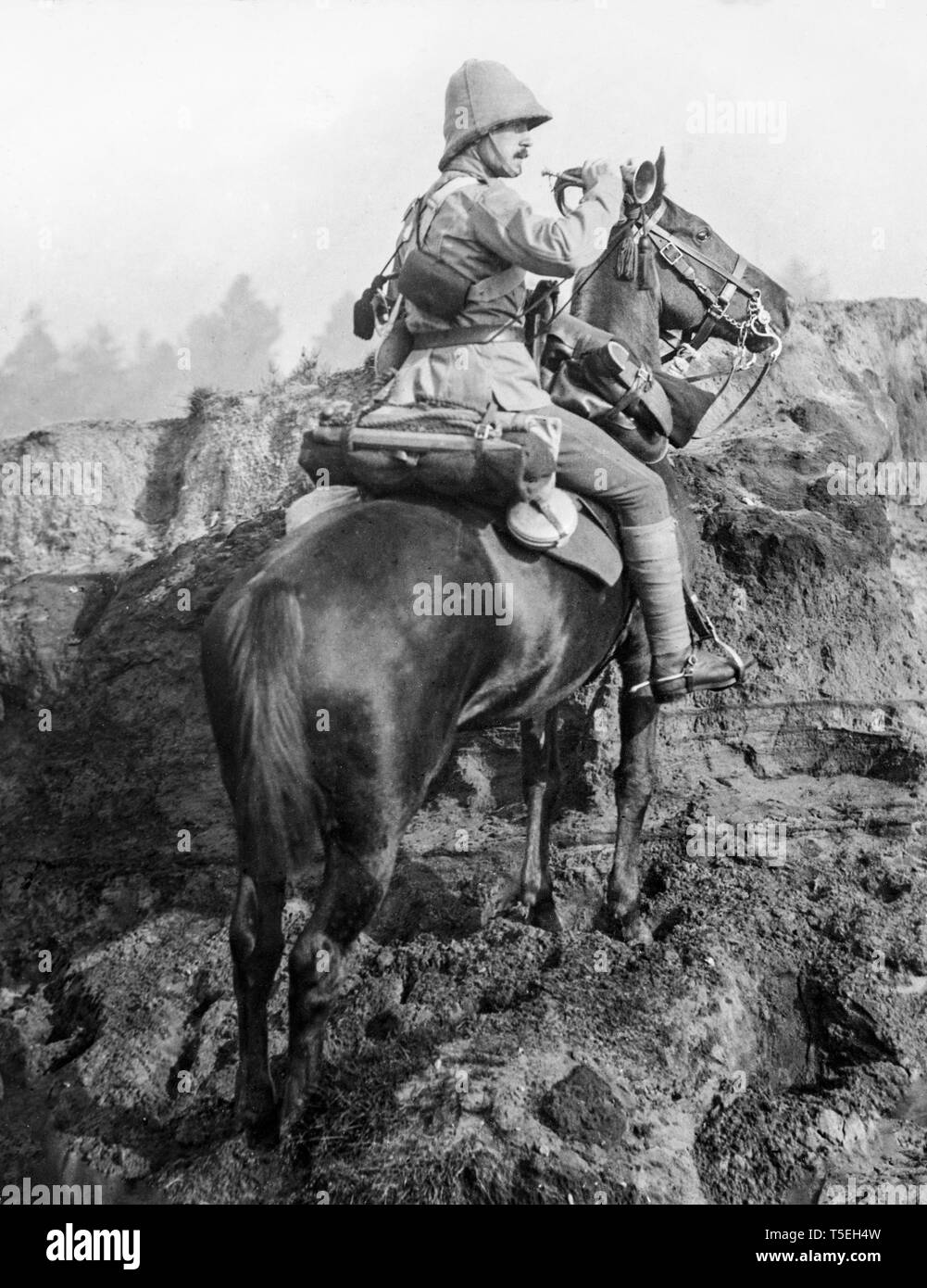Photograph taken during the Boer War in Southern Africa, showing a bugler from the 13th Hussars, a British Regiment, on horseback. Stock Photo