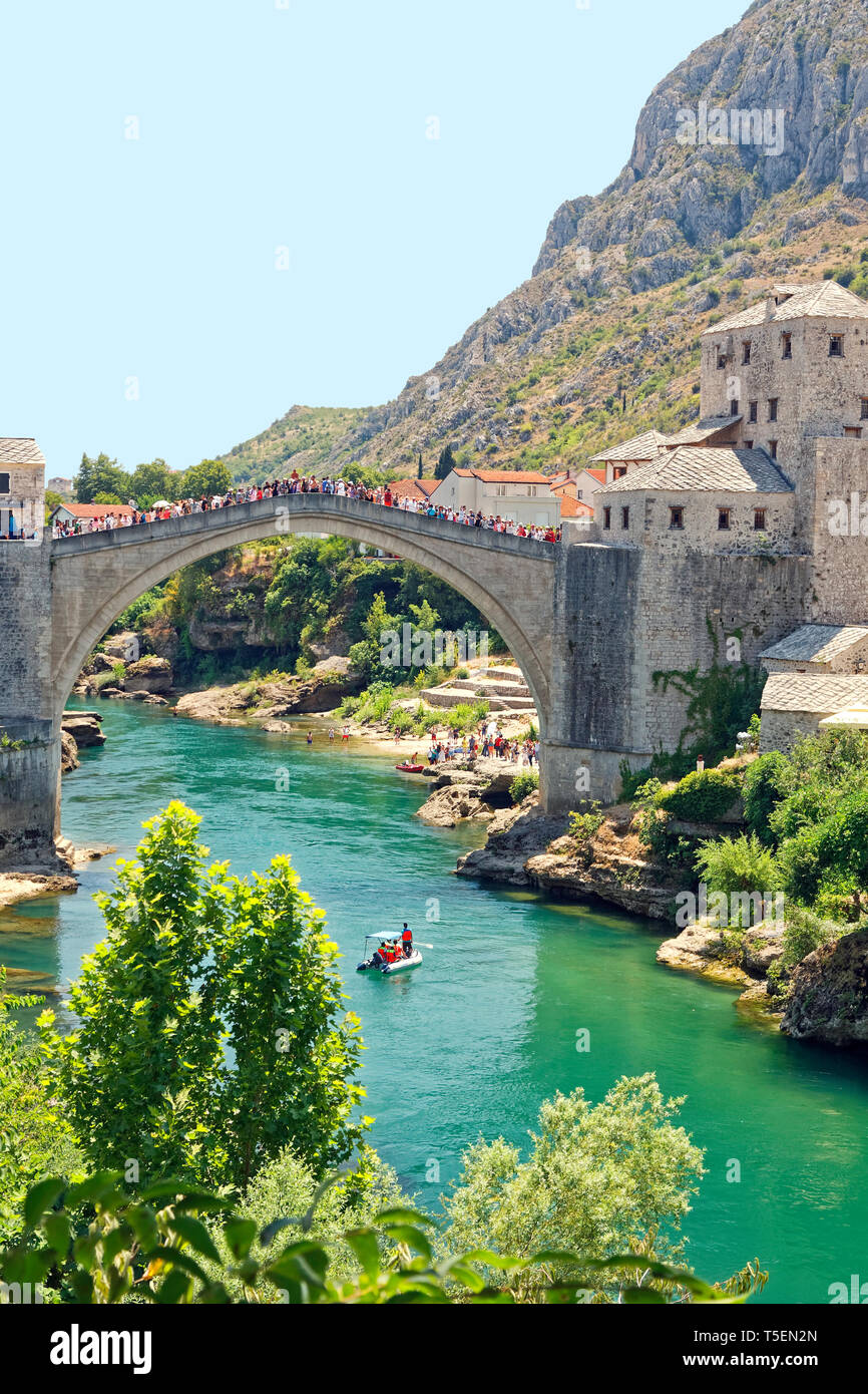Stari Most; Old Bridge; 16 century Ottoman structure, River Neretva; arched design; crowd of people, UNESCO World Heritage site; Mostar; Bosnia Herzeg Stock Photo