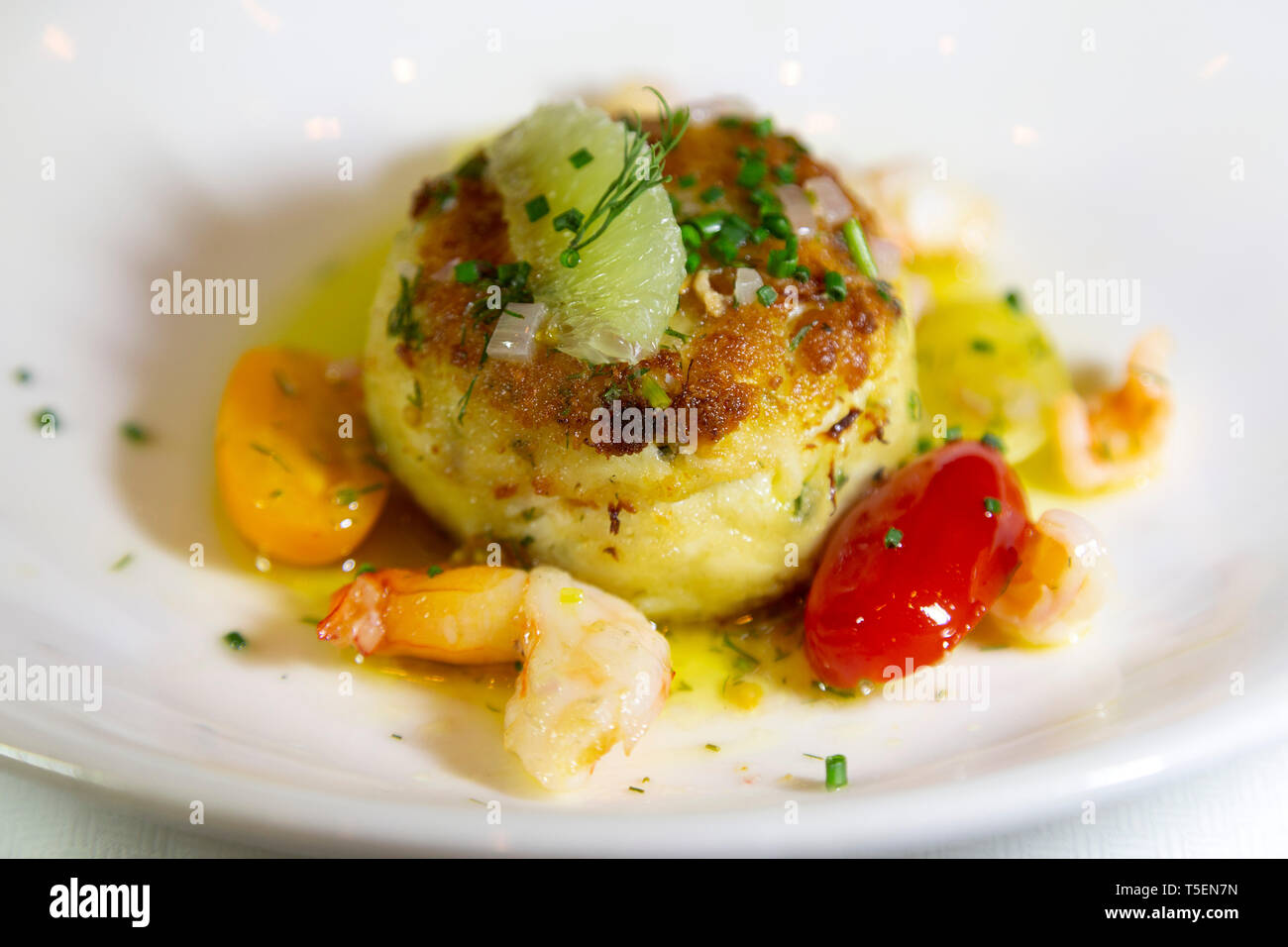 Crab cake served served as an appetizer Stock Photo Alamy