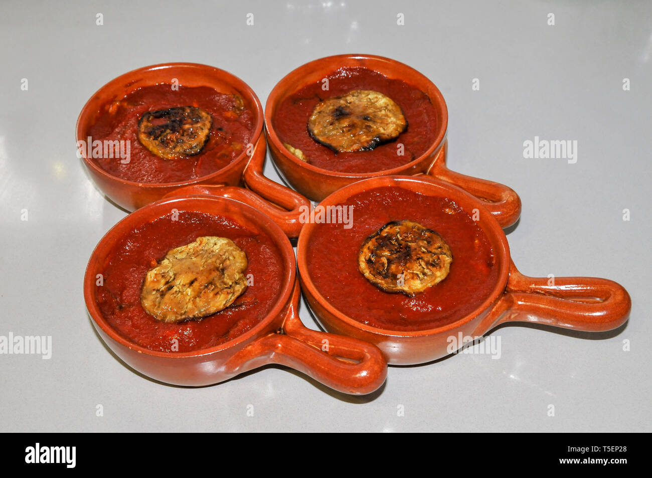 Home cooking - grilled eggplant with tomato puree Stock Photo