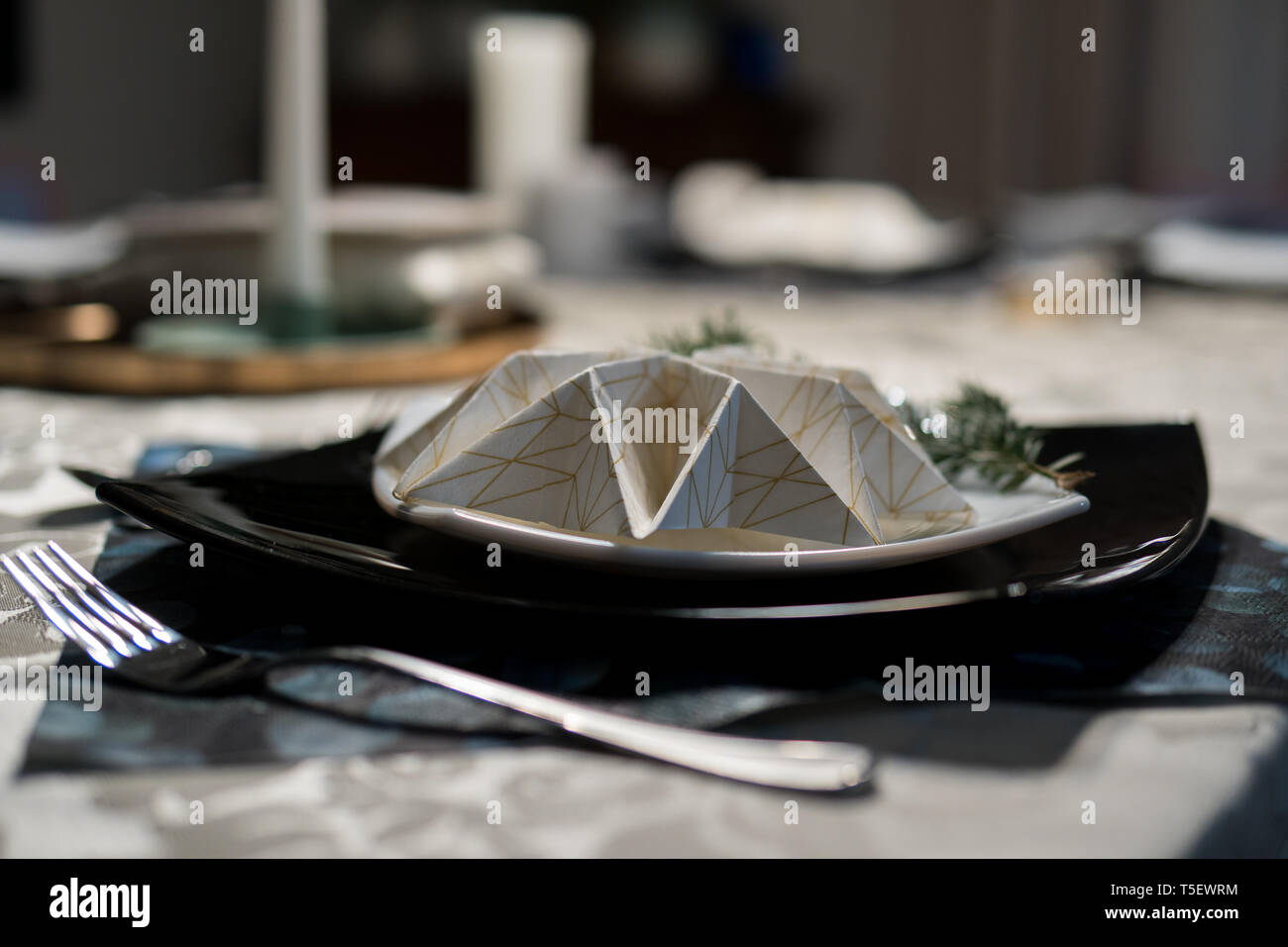 elegant table setting with decoration for dinner in regular home Stock Photo