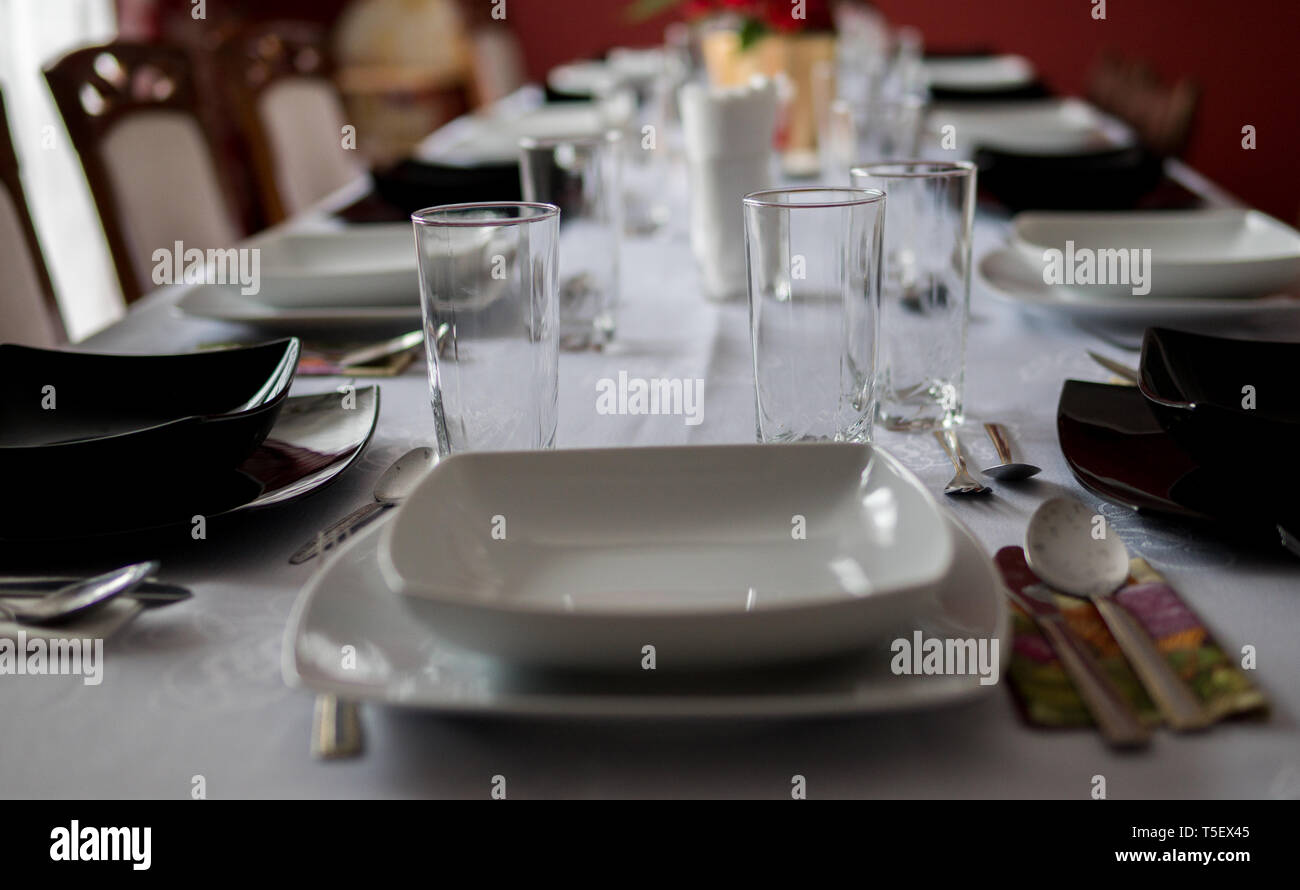 elegant table setting with decoration for dinner in regular home Stock Photo
