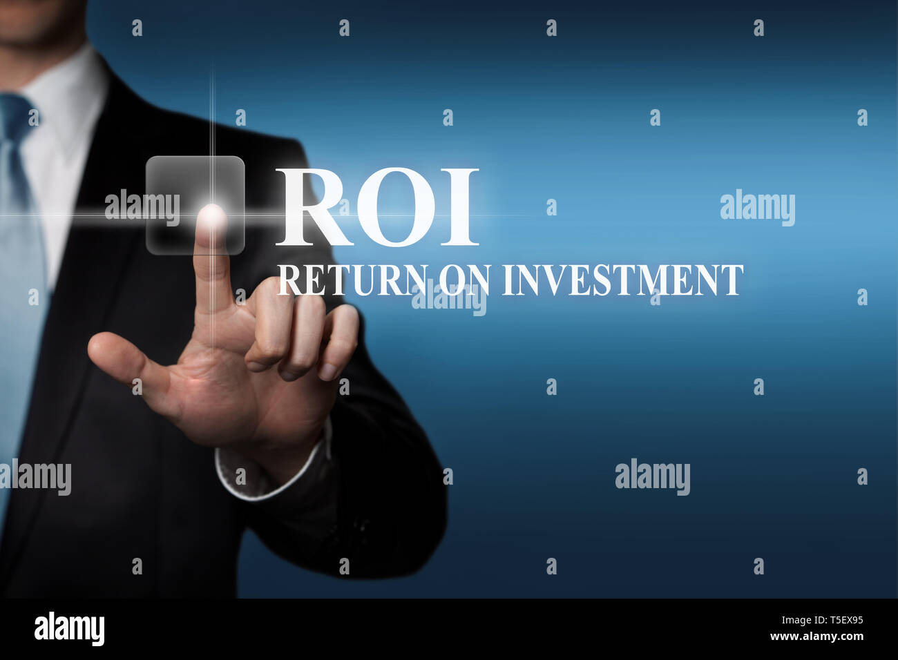 business concept - businessman in suit presses virtual touchscreen button - ROI Return On Investment Stock Photo