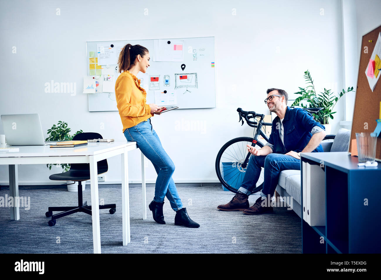 Two colleagues with tablet meeting in office Stock Photo