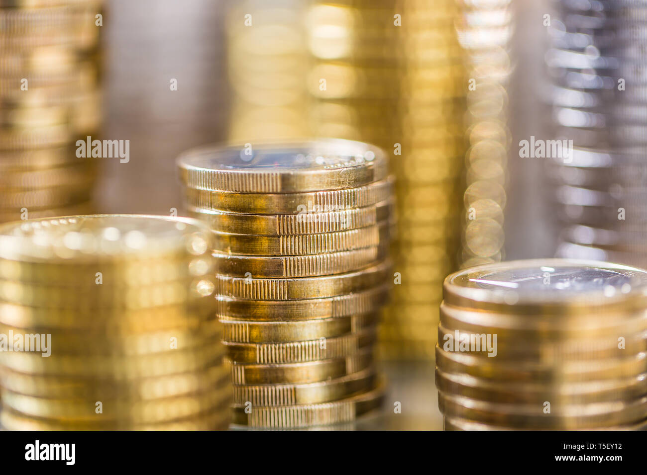 Towers of the euro coins stacked in different positions Stock Photo Alamy