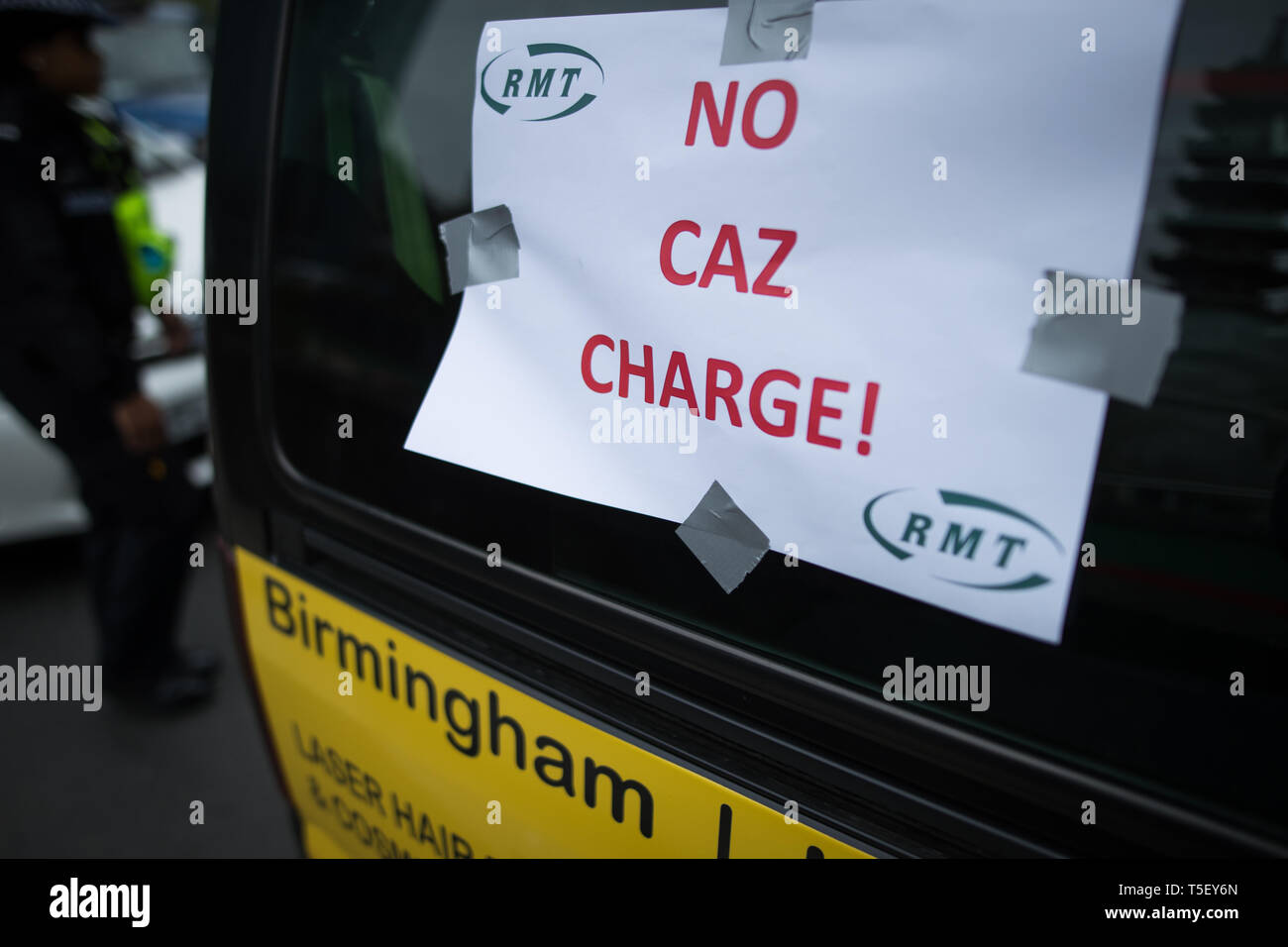 Taxis during a 'go slow' protest on the Holloway Circus roundabout in Birmingham City Centre as drivers protest over the city councils plans for a new clean air zone in Birmingham. Stock Photo
