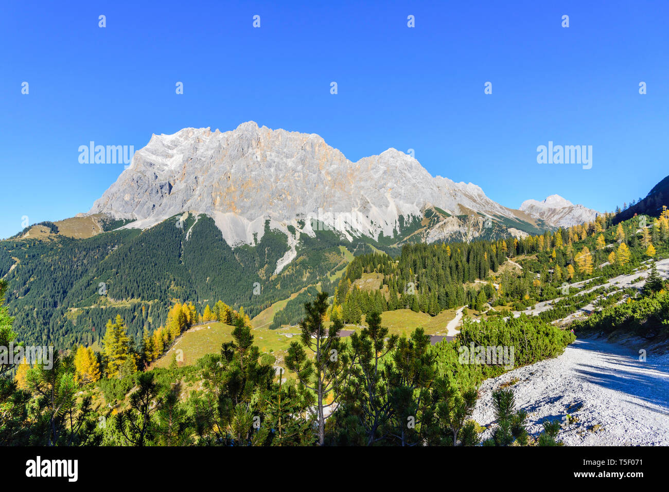 Impressive view to the mighty rock wall of the Zugspitz massif from western side in falltime Stock Photo