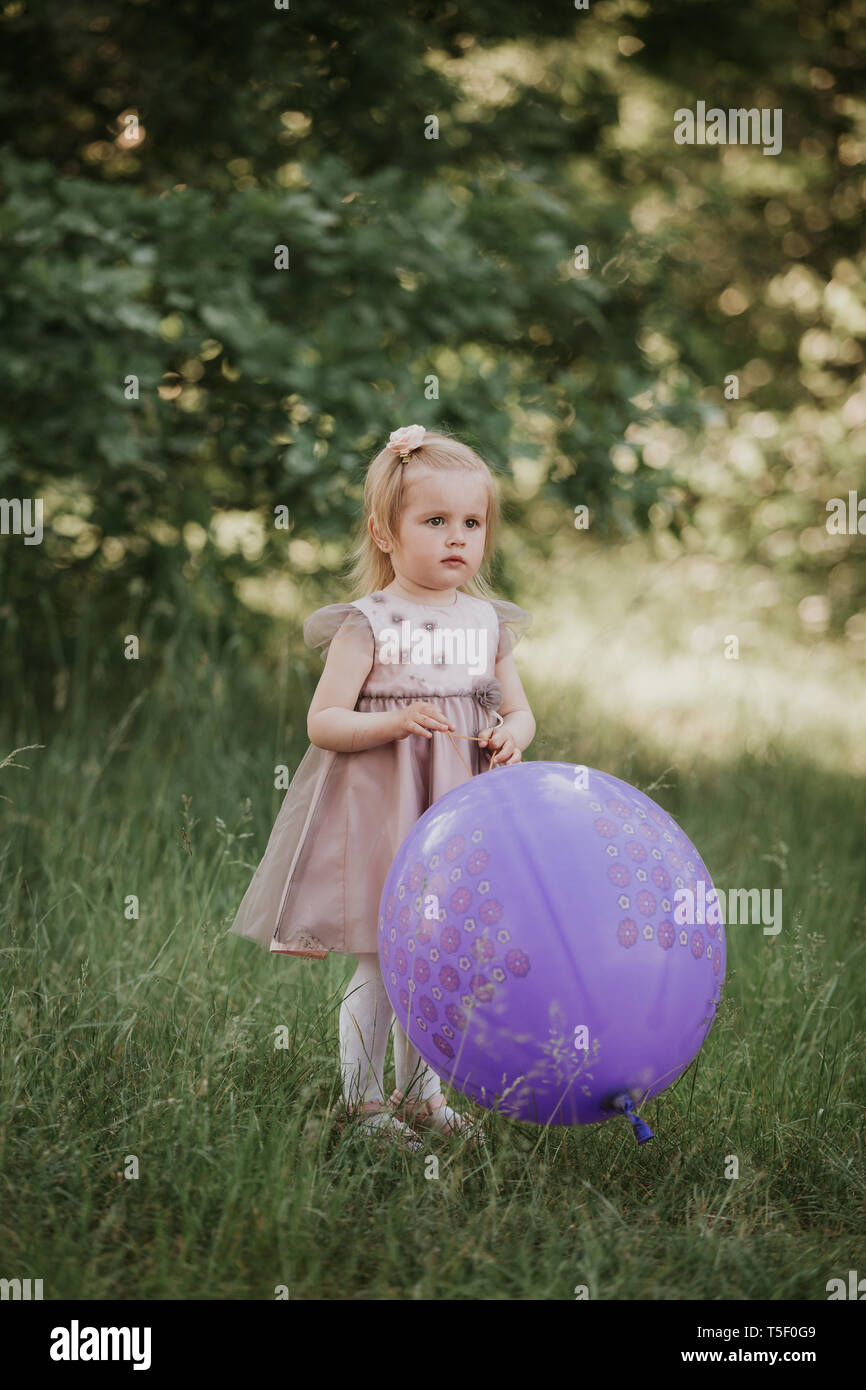 Stylish baby girl 2-5 year old holding big balloon wearing trendy ...