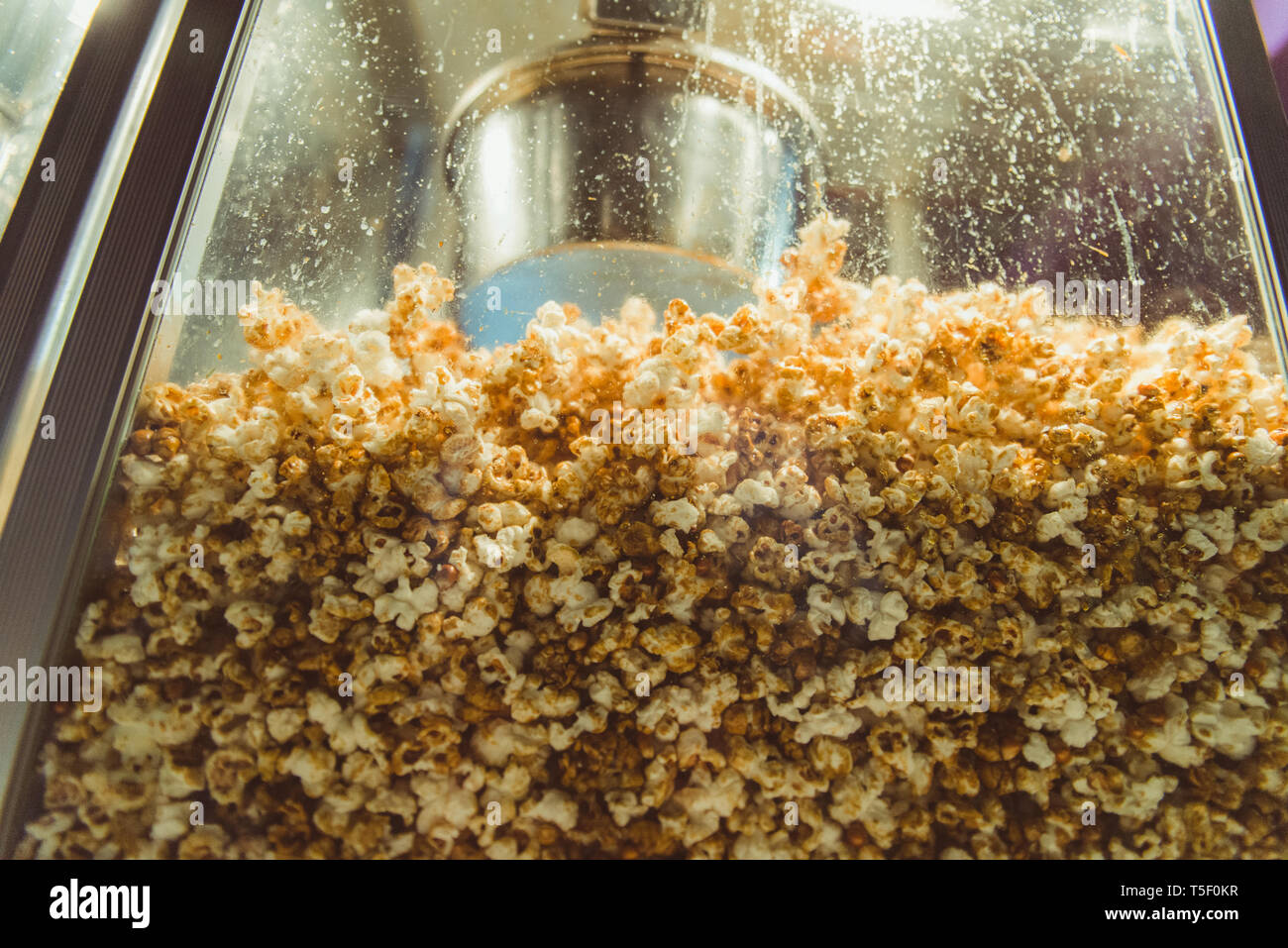 Popcorn machine on the street, street food, snack on the city, popcorn at the festivity Stock Photo