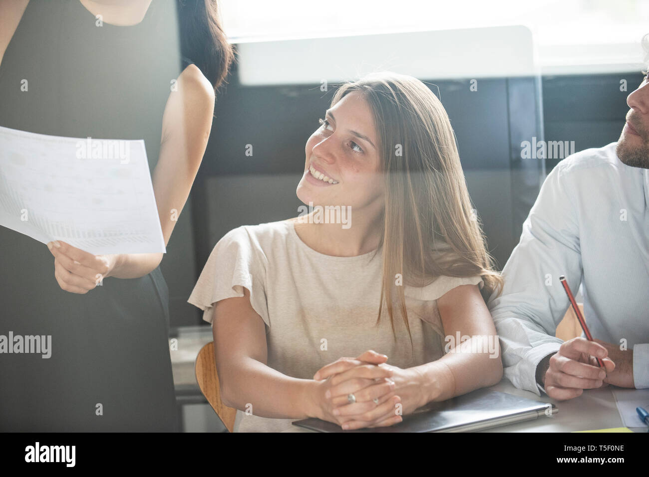 Businesswoman giving presentation in office Stock Photo