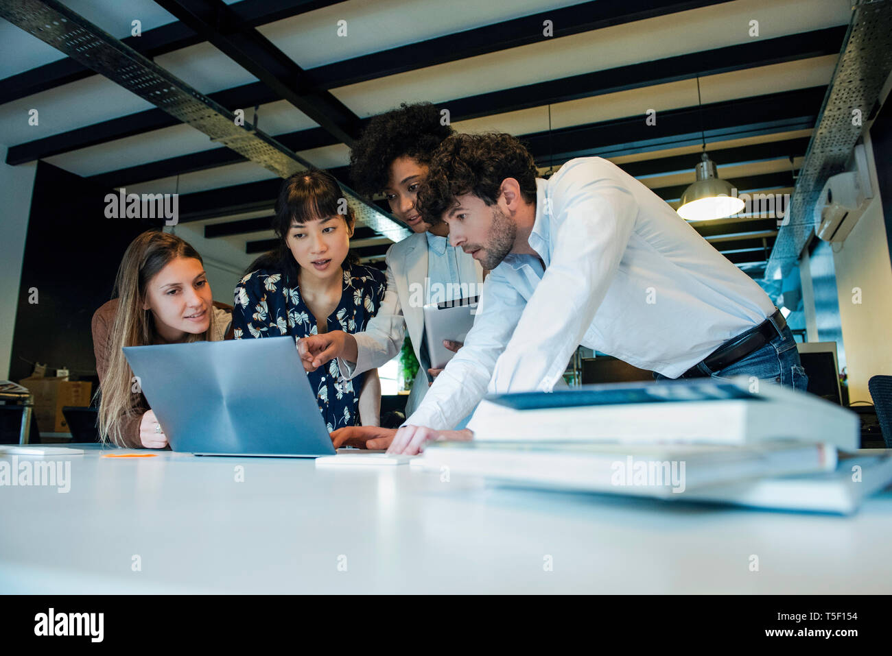 Business people using laptop in office Stock Photo