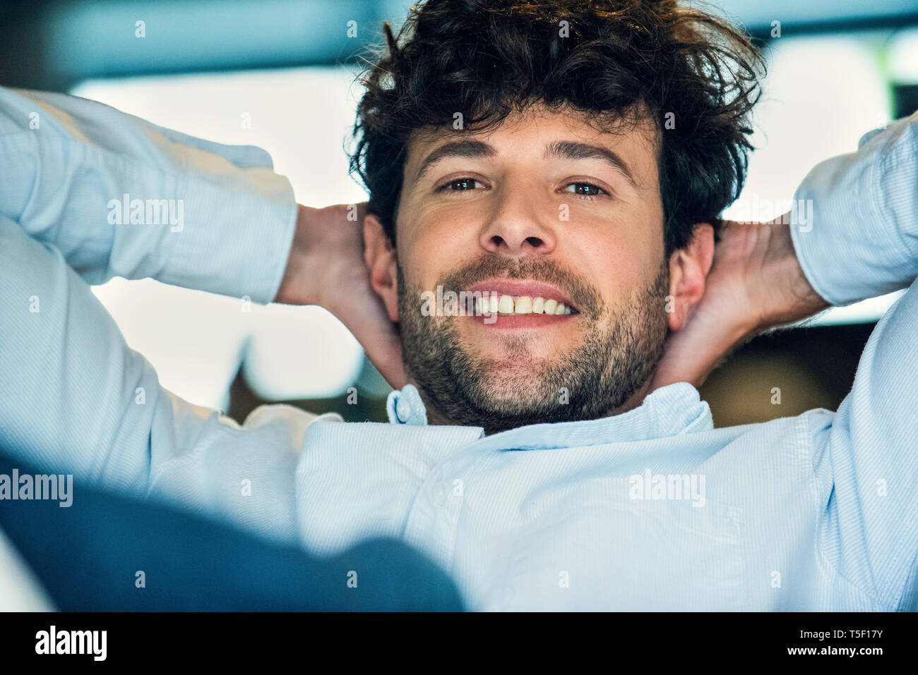 Sitting hands behind the head hi-res stock photography and images - Alamy