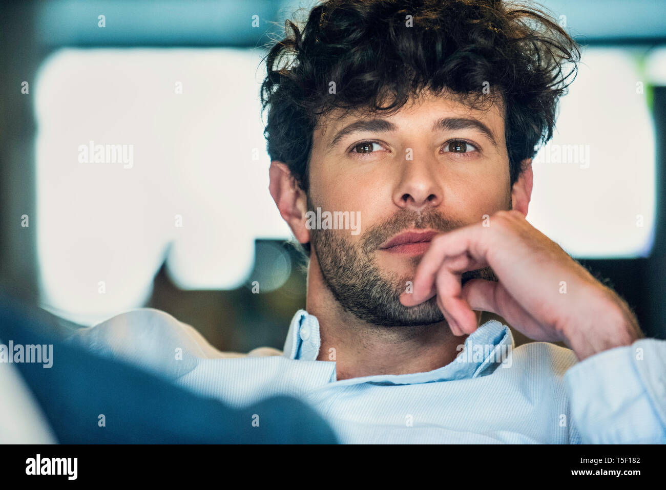 Businessman sitting in office Stock Photo