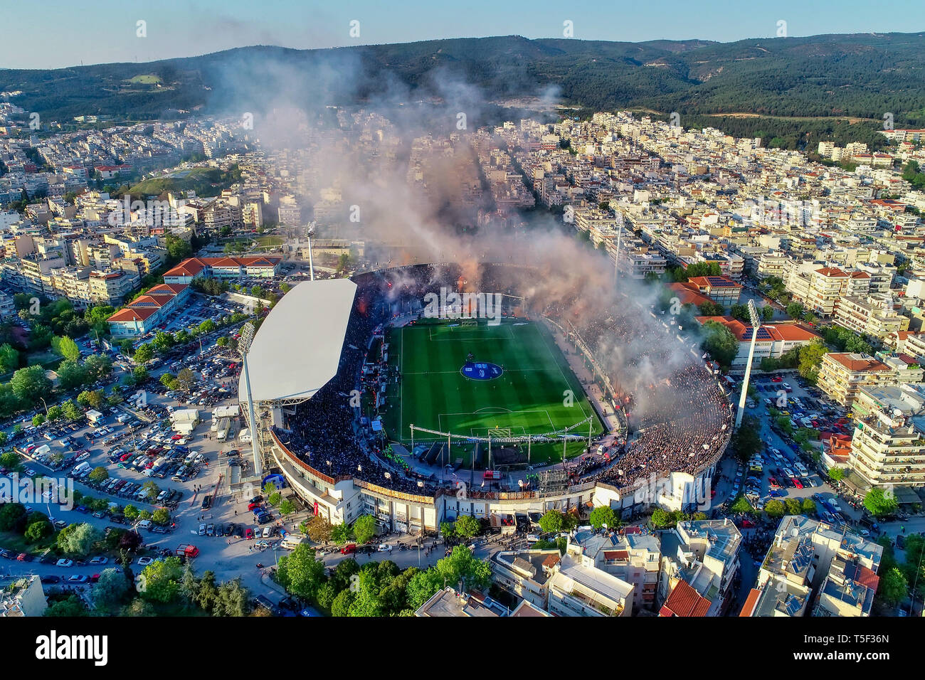 Thessaloniki, Greece, April 21, 2019: Aerial shoot of the Toumba Stadium full of fans of PAOK celebrating the winning of the Greek Super League champi Stock Photo