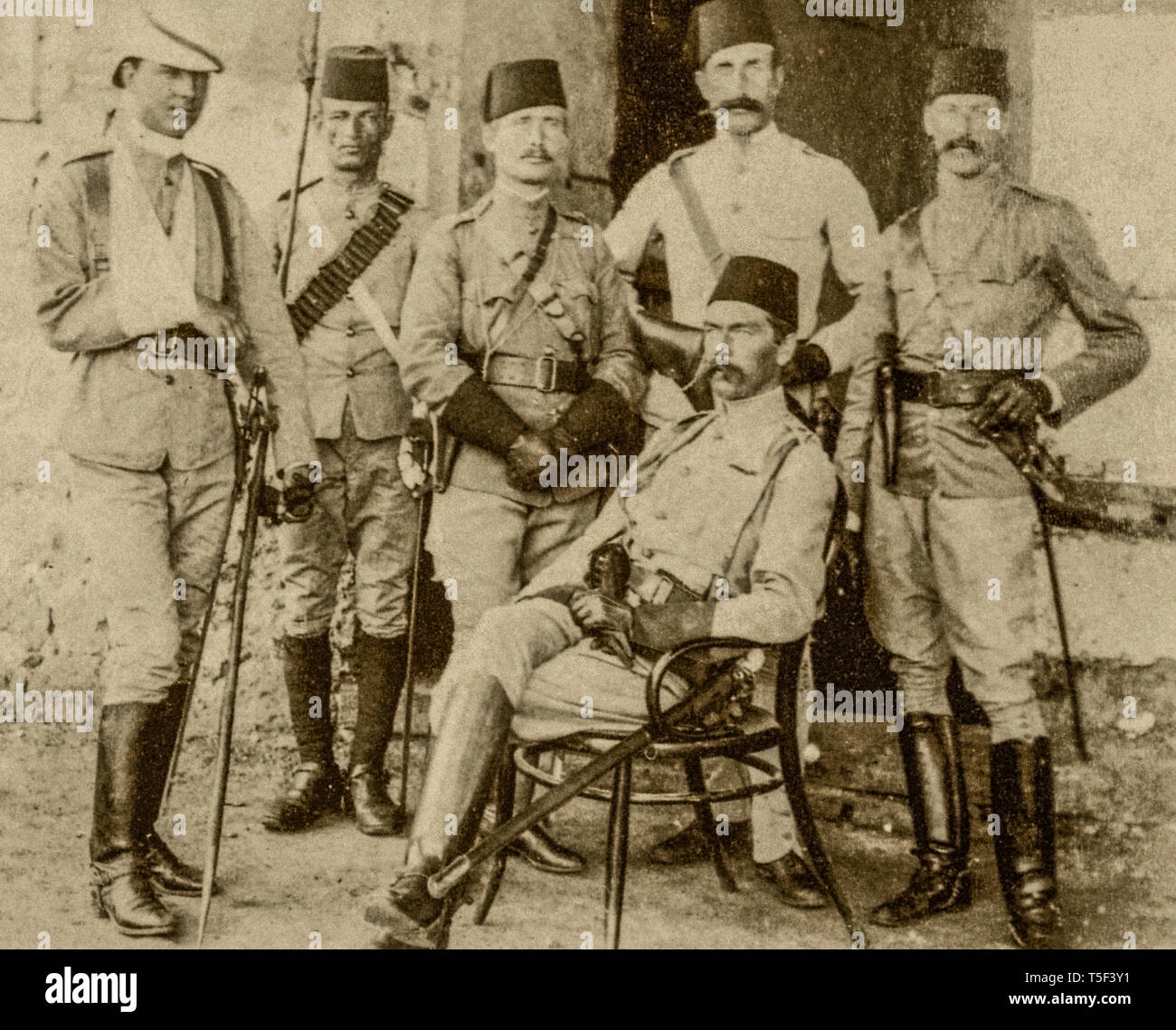 Mahdist war  ( 1881 - 1899)  -Kichener (seated) with a group of English officers of the Egyptian weapon and an exponent of the Egyptian Cavalry troop (Second from the left). This photograph was taken after the battle of Gemaizeh in 1888, in which the young officer on the left was allegedly injured. Stock Photo