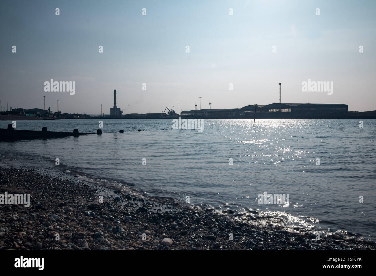 Shoreham harbour showing the power station and wind turbines, West Sussex, UK Stock Photo