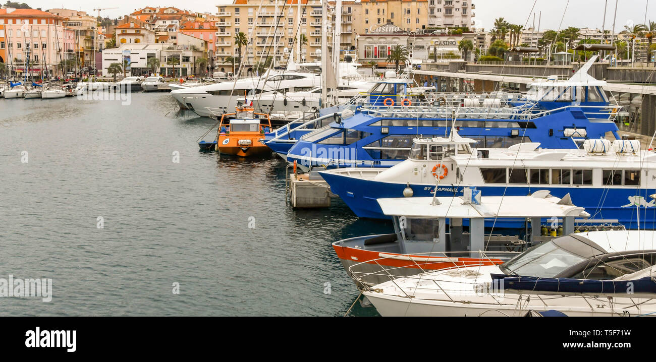 SAN RAPHAEL, FRANCE - APRIL 2019:  Small passenger ferries and sightseeing boats tied up in the harbour in San Raphael Stock Photo