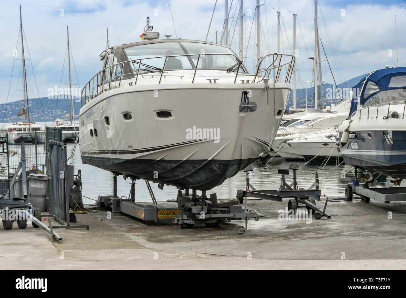SAN RAPHAEL, FRANCE - APRIL 2019: Luxury motor cruiser out of water on a trolley in a boatyard in San Raphael Stock Photo