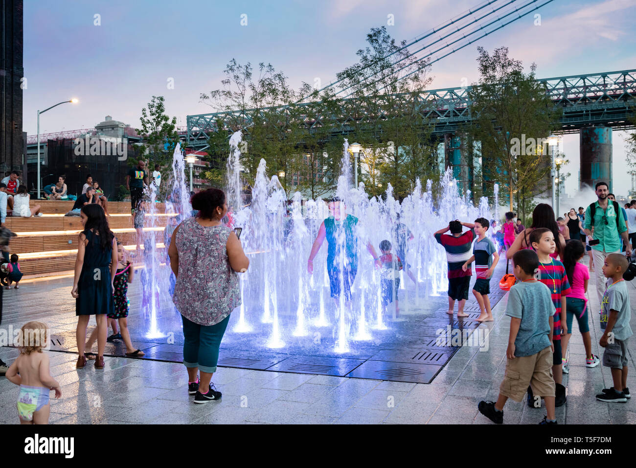 Children playing in the fountain. Domino Park, Brooklyn, United States ...