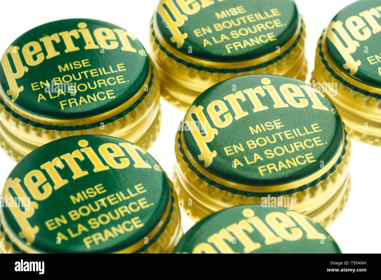 Perrier Bottle Tops, Perrier is a French brand of natural mineral water from its source in Vergeze. Stock Photo