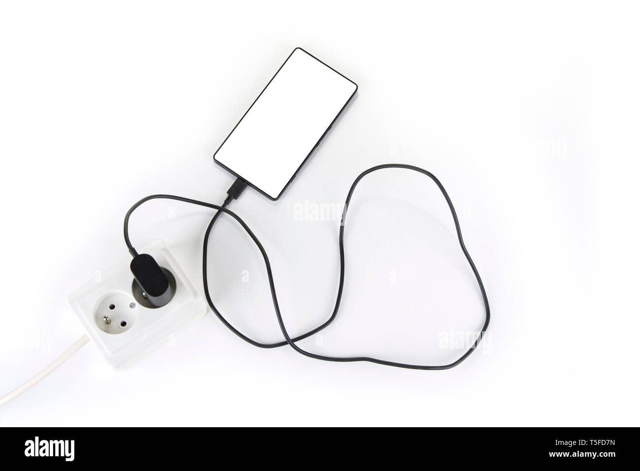 Smartphone charger plug in the socket Stock Photo Alamy