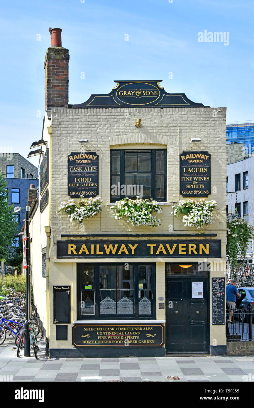 Detached old Railway Tavern pub building facade & advertising panels for product range of ales wines spirits & home cooked food Chelmsford Essex UK Stock Photo