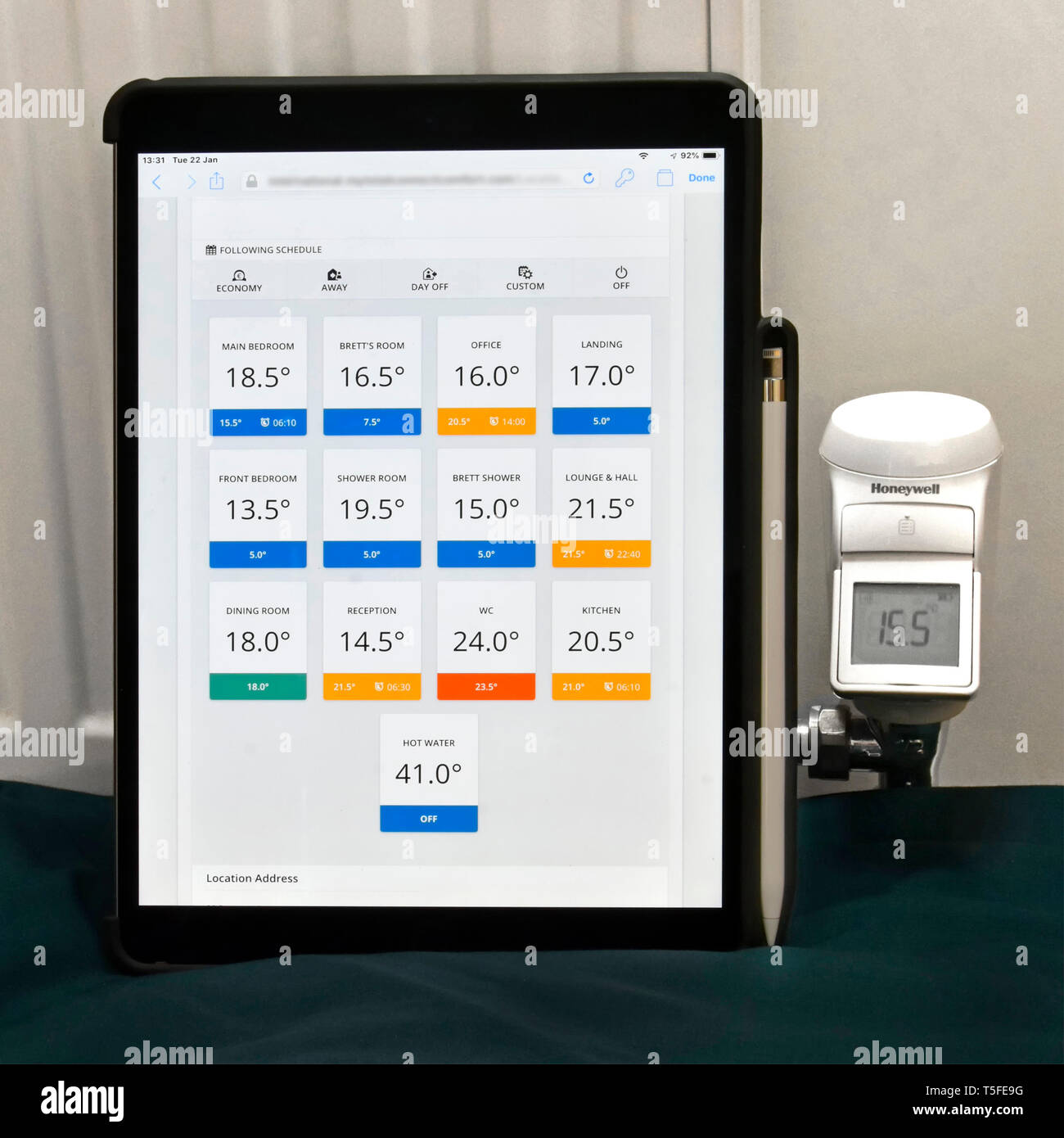 iPad & actual app mock up smart home central heating radiator zones for remote control technology via Honeywell trv & Evohome motorised LED valve  UK Stock Photo