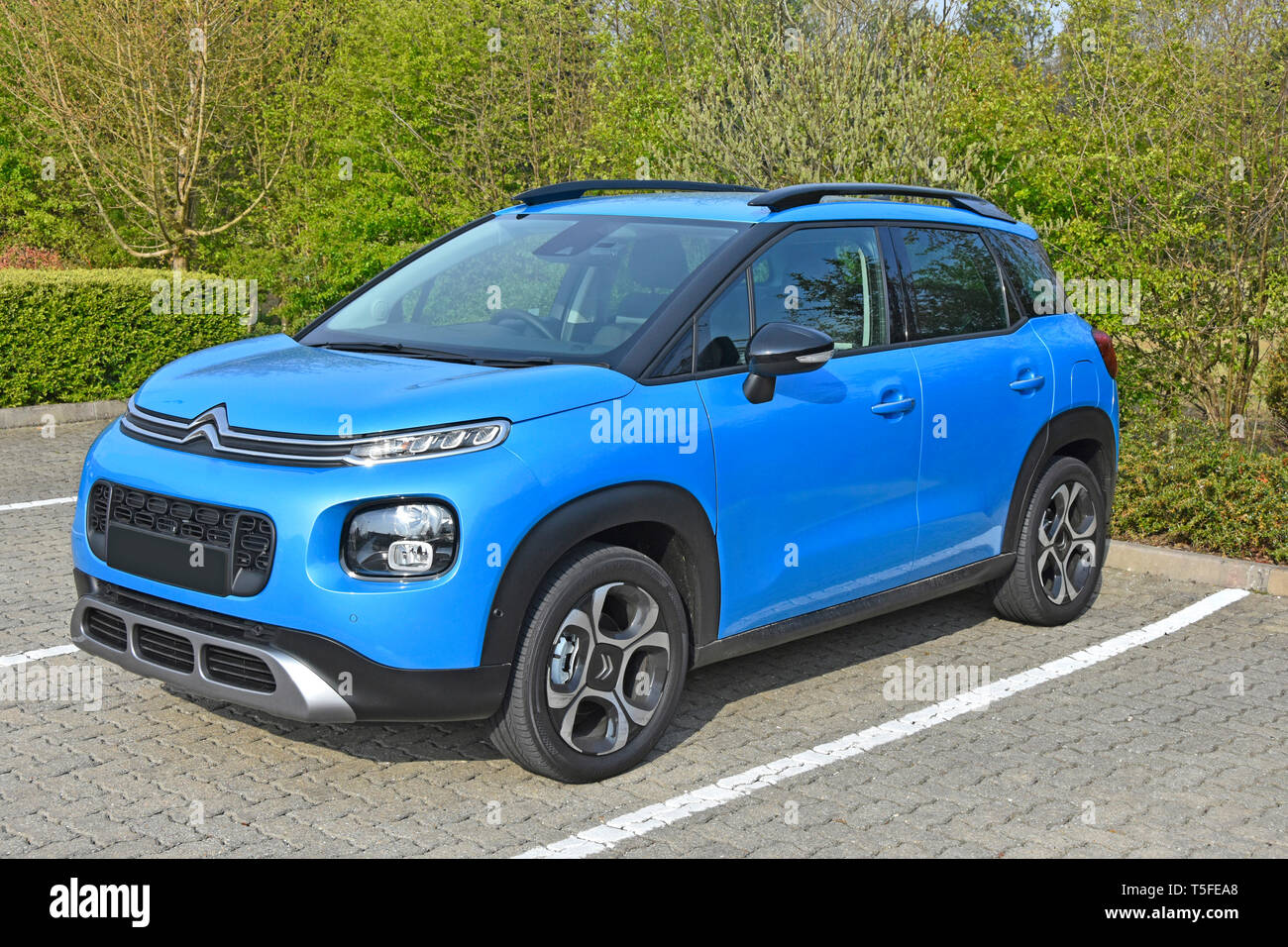 Side & front view of a new 2019 blue Citroen C3 Aircross mini SUV Flair variant with petrol engine 5 door right hand drive hatchback automobile car uk Stock Photo