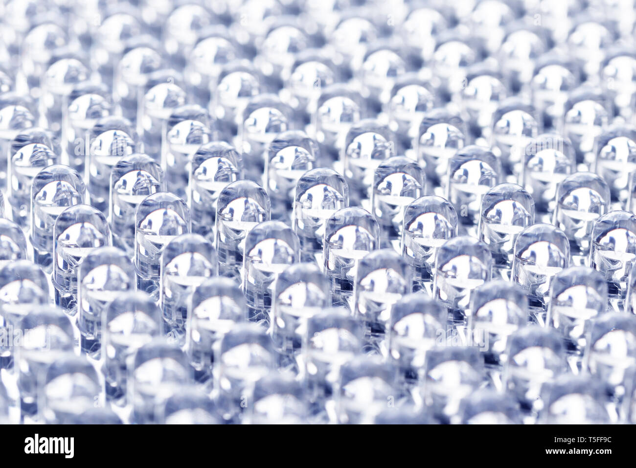 Straight rows of LEDs in the panel close-up macro. Purple neon glow Stock Photo