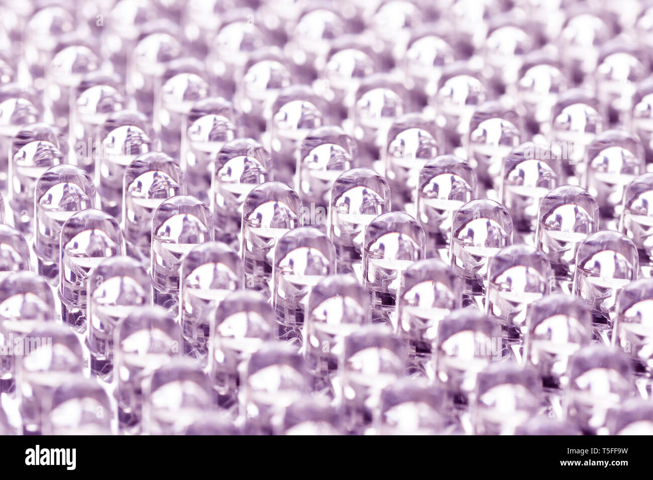 Straight rows of LEDs in the panel close-up macro. Blue neon glow Stock Photo