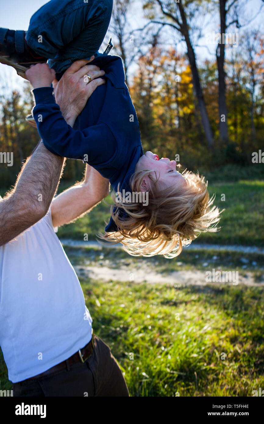 Father playing with his little son  outdoors Stock Photo