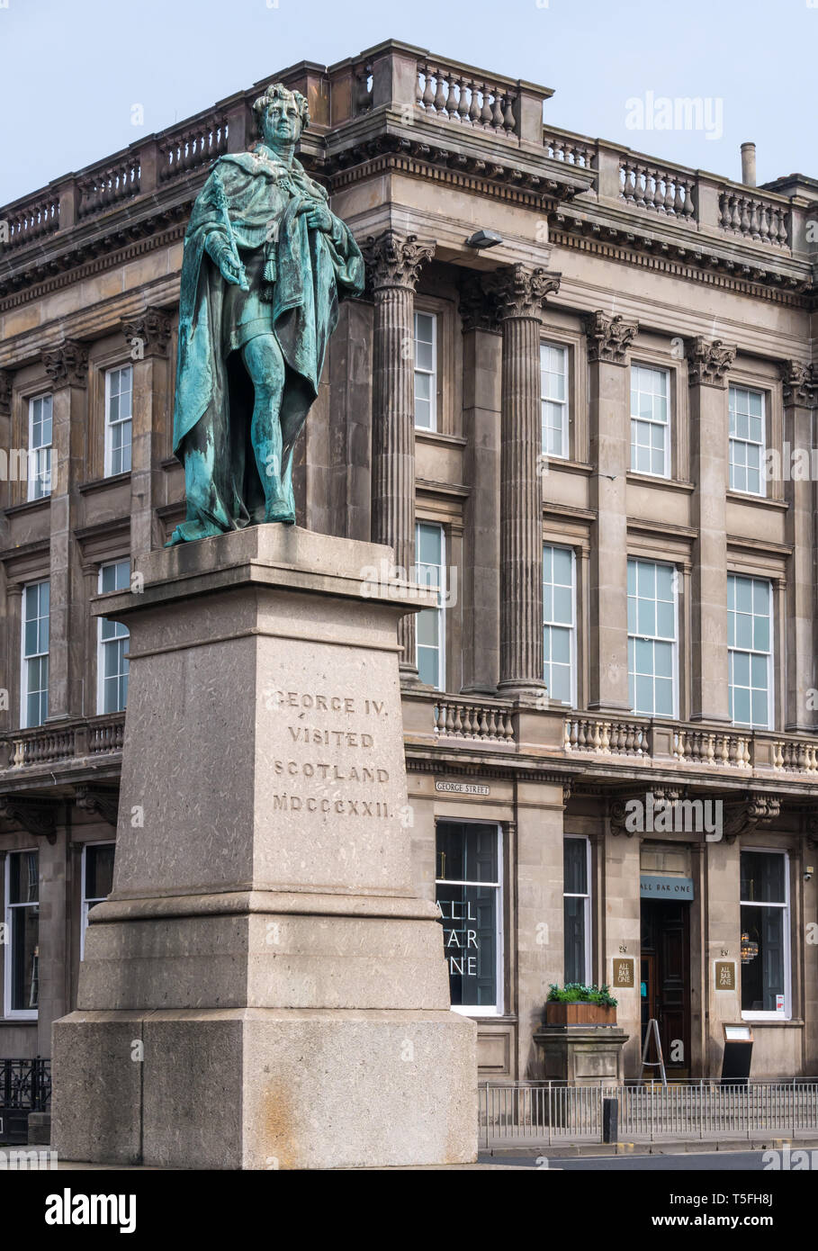 Bronze statue of King George IV on plinth by Sir John Steell, George Street, Edinburgh New Town, Scotland, UK Stock Photo