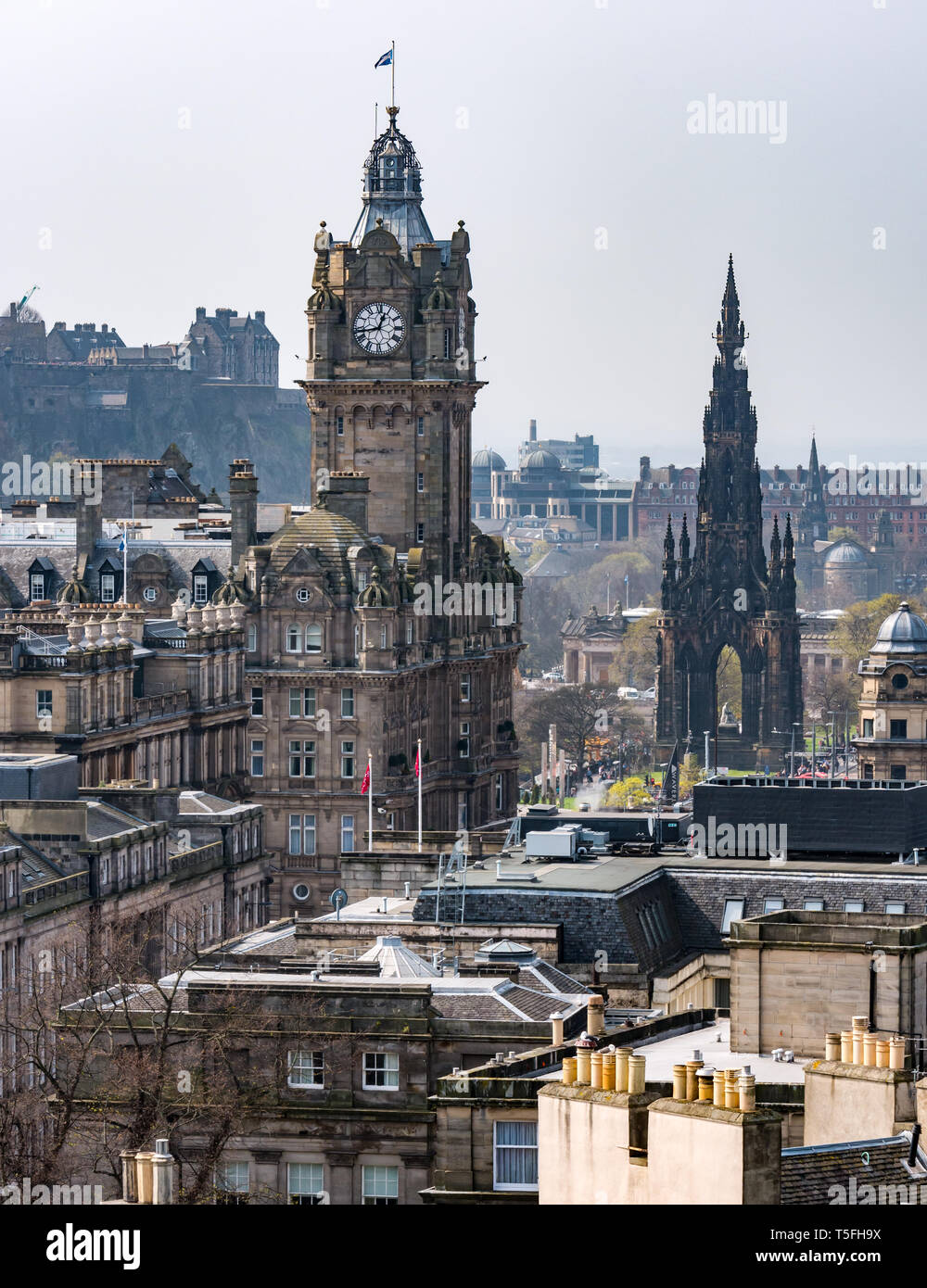 Balmoral Hotel clock tower and Scott monument with city skyline, Edinburgh city centre, Scotland, UK Stock Photo