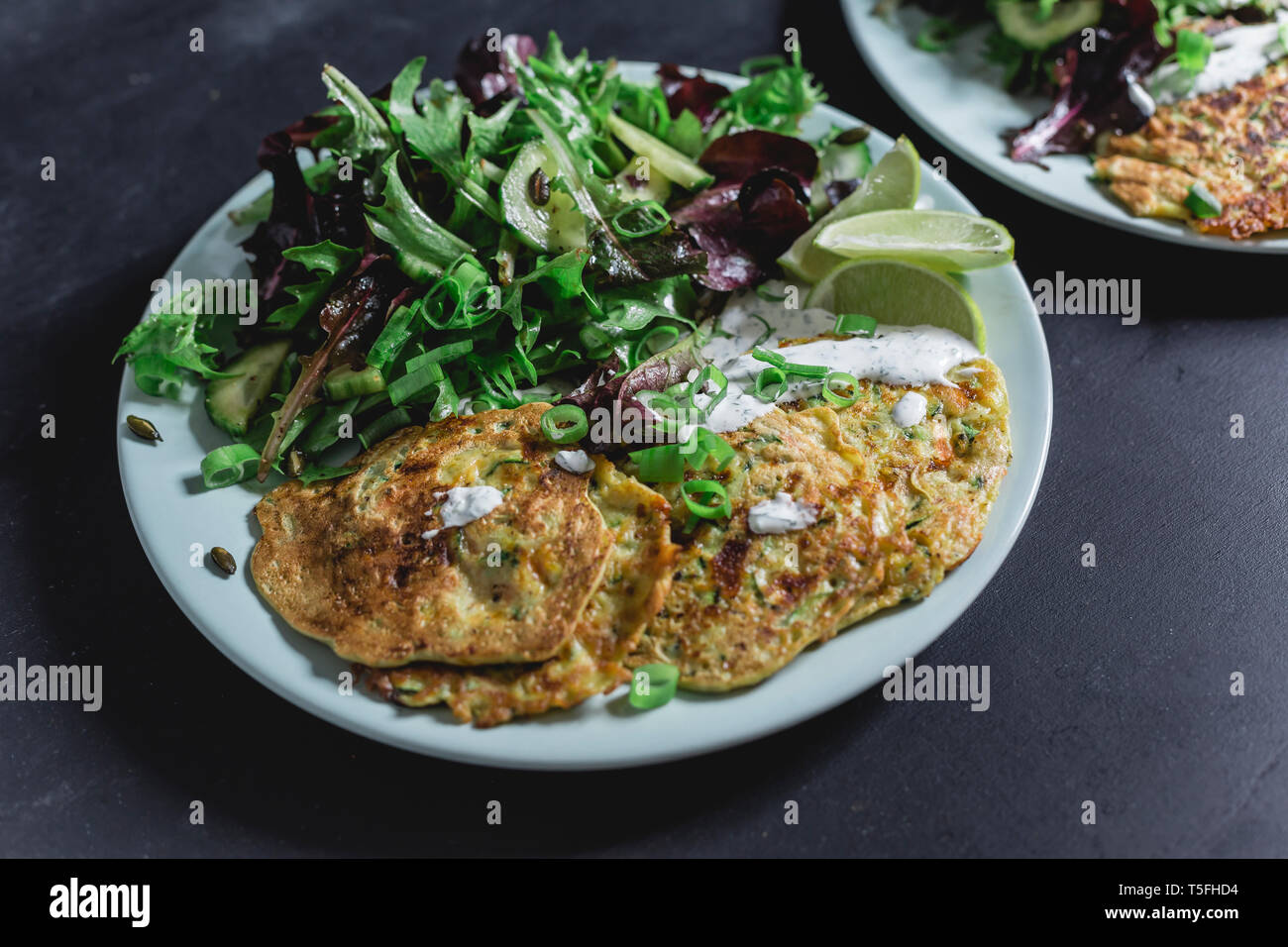 Vegetable cheese fritter with salad on plate Stock Photo