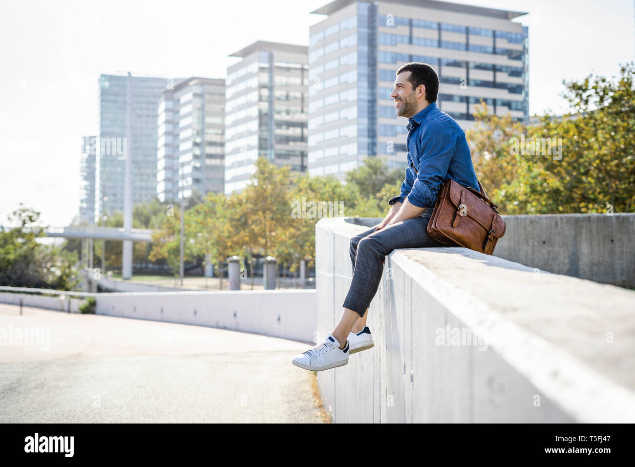 Relaxed man sitting hi-res stock photography and images - Alamy