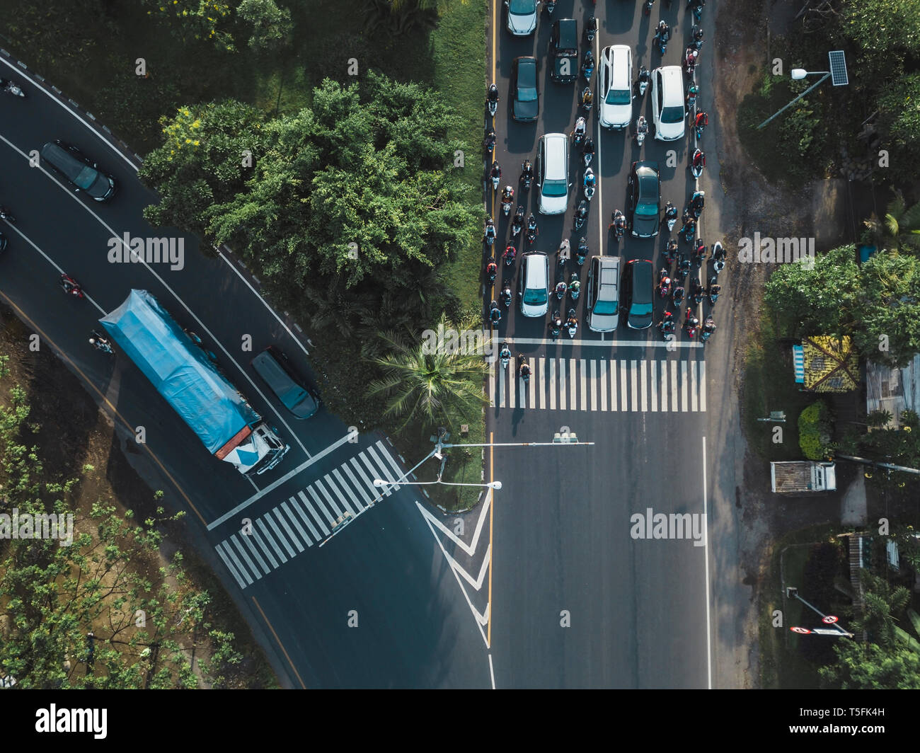 Indonesia, Bali, Sanur, Aerial view of cars, motorbikes and a truck on the road Stock Photo
