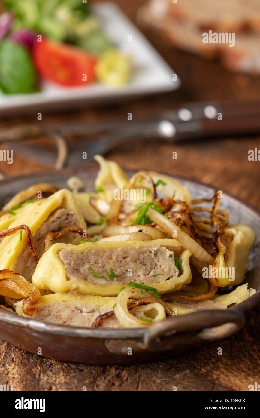 swabian maultasche with onions in a pan Stock Photo - Alamy