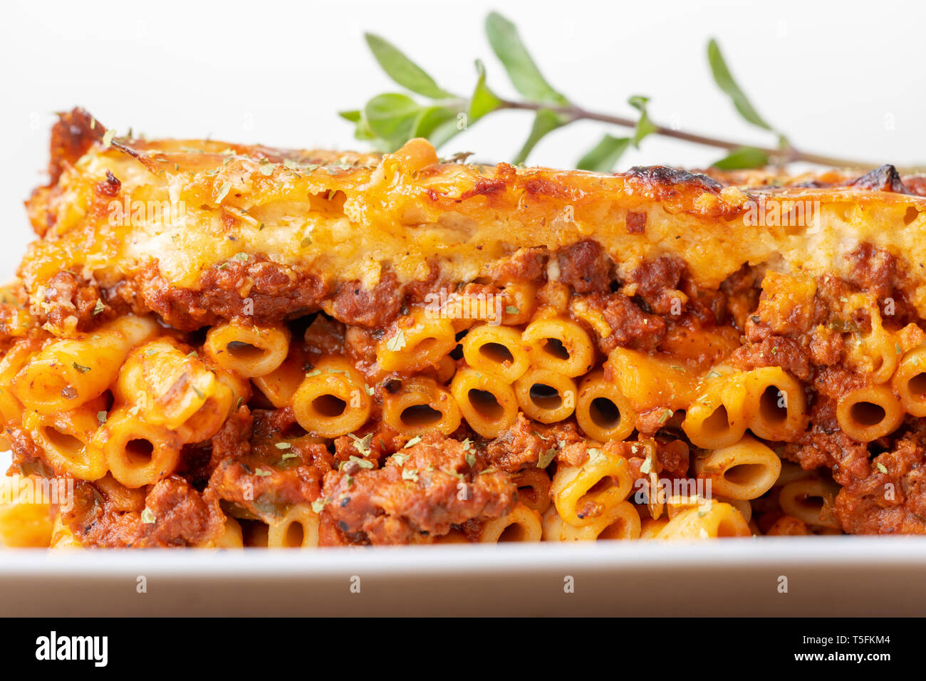 greek pastizio noodle dish with cheese Stock Photo - Alamy