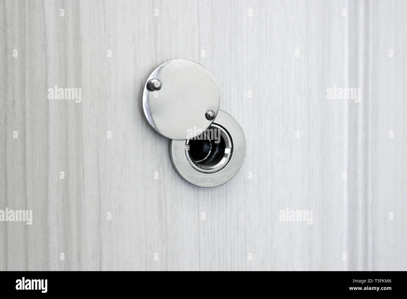 Door peephole from the chromeplated steel in an entrance door from