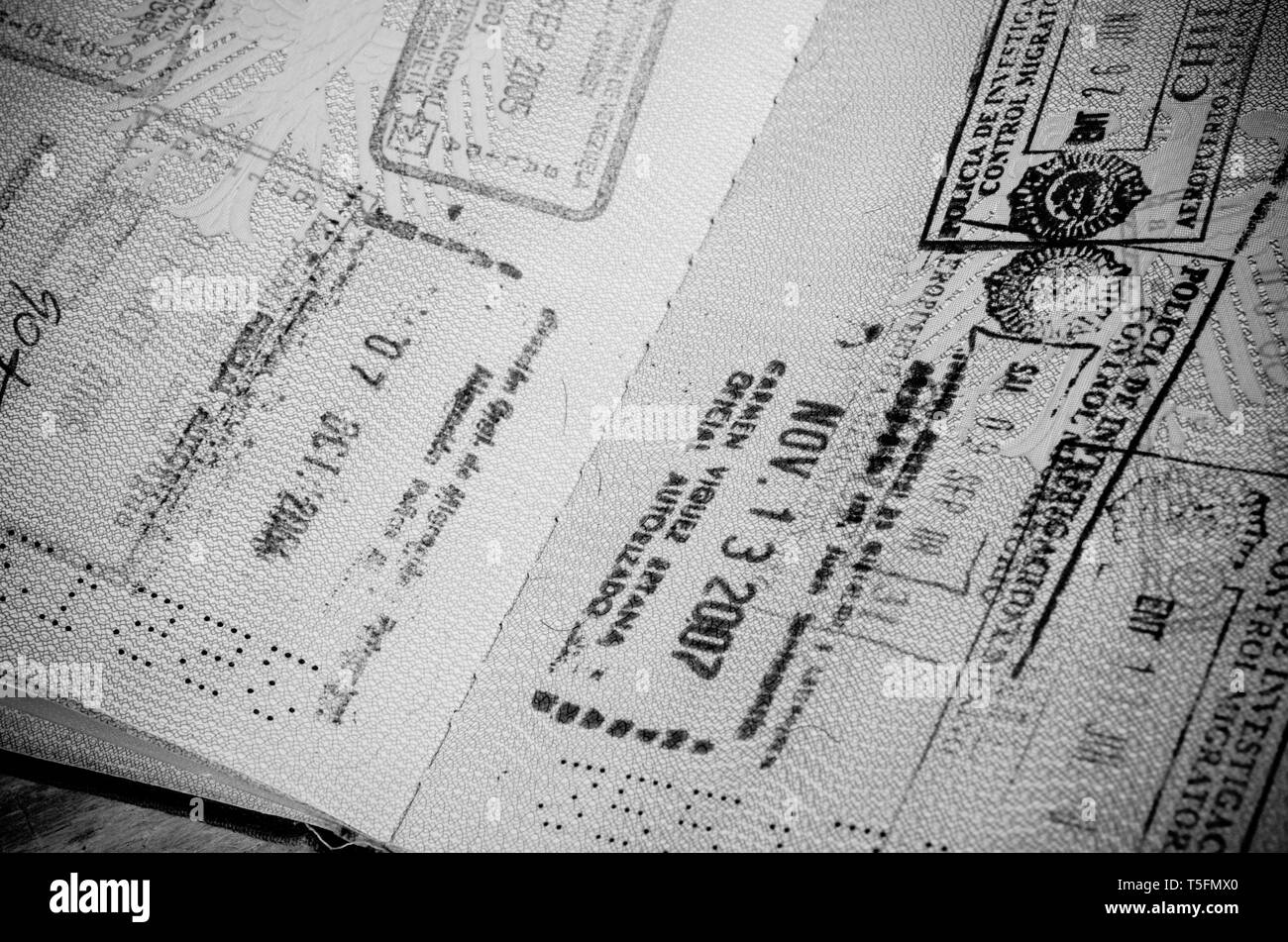 Old passport full of stamps from many countries Stock Photo