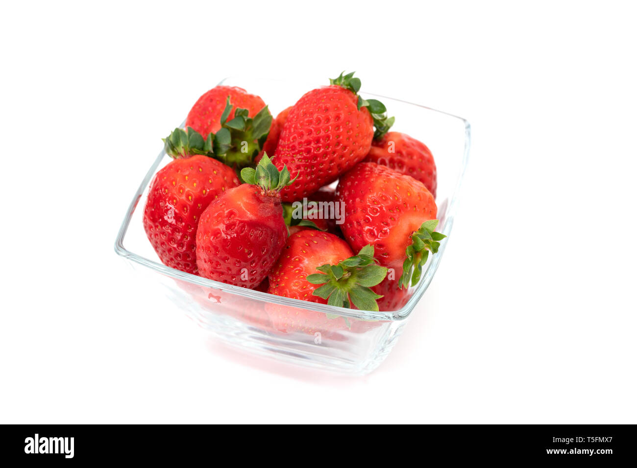 Glass bowl filled with over ripe strawberries Stock Photo