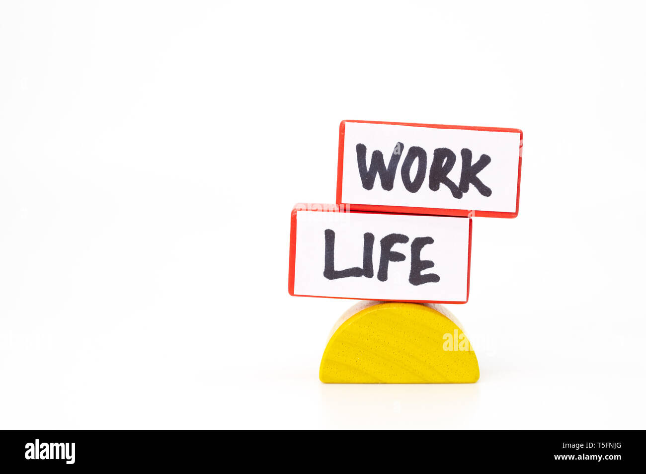Work life balance concept with two blocks representing work and life Stock Photo