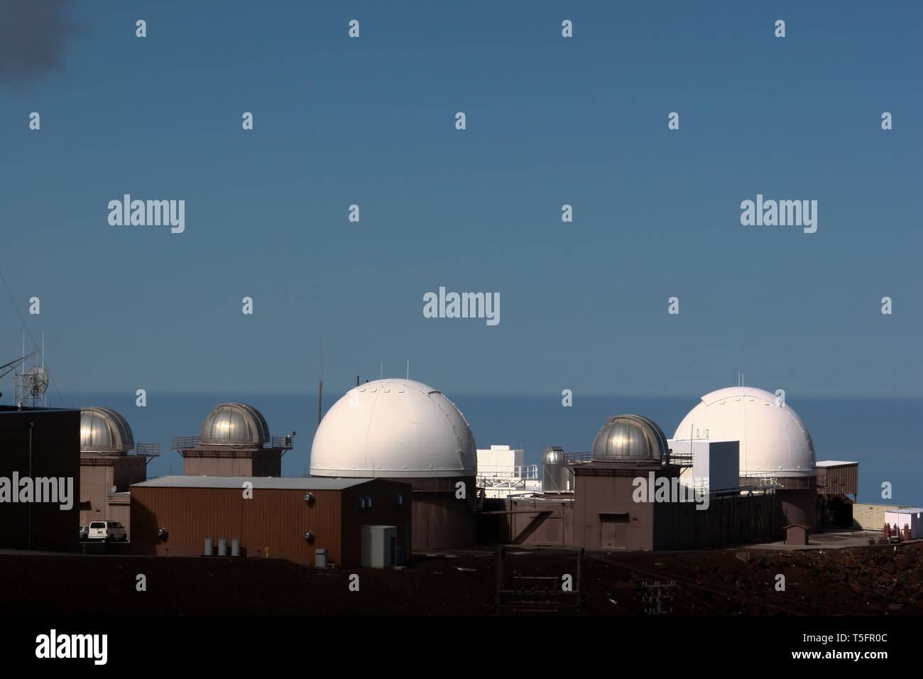 Pan-STARRS telescopes consists of astronomical cameras, telescopes and a computing facility that is surveying the sky for moving or variable objects. Stock Photo