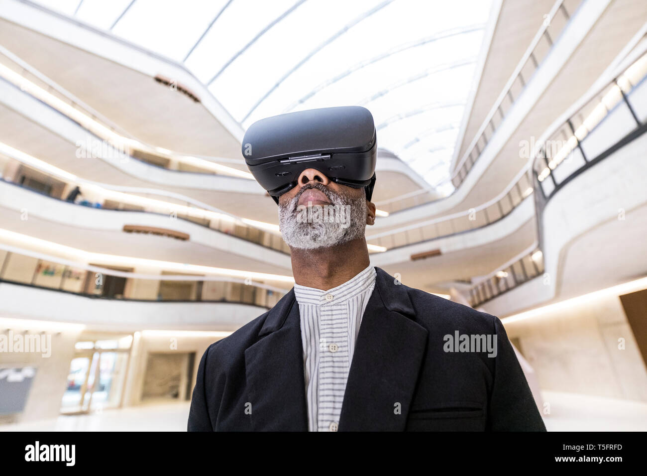 Bearded businessman using Virtual Reality Glasses Stock Photo