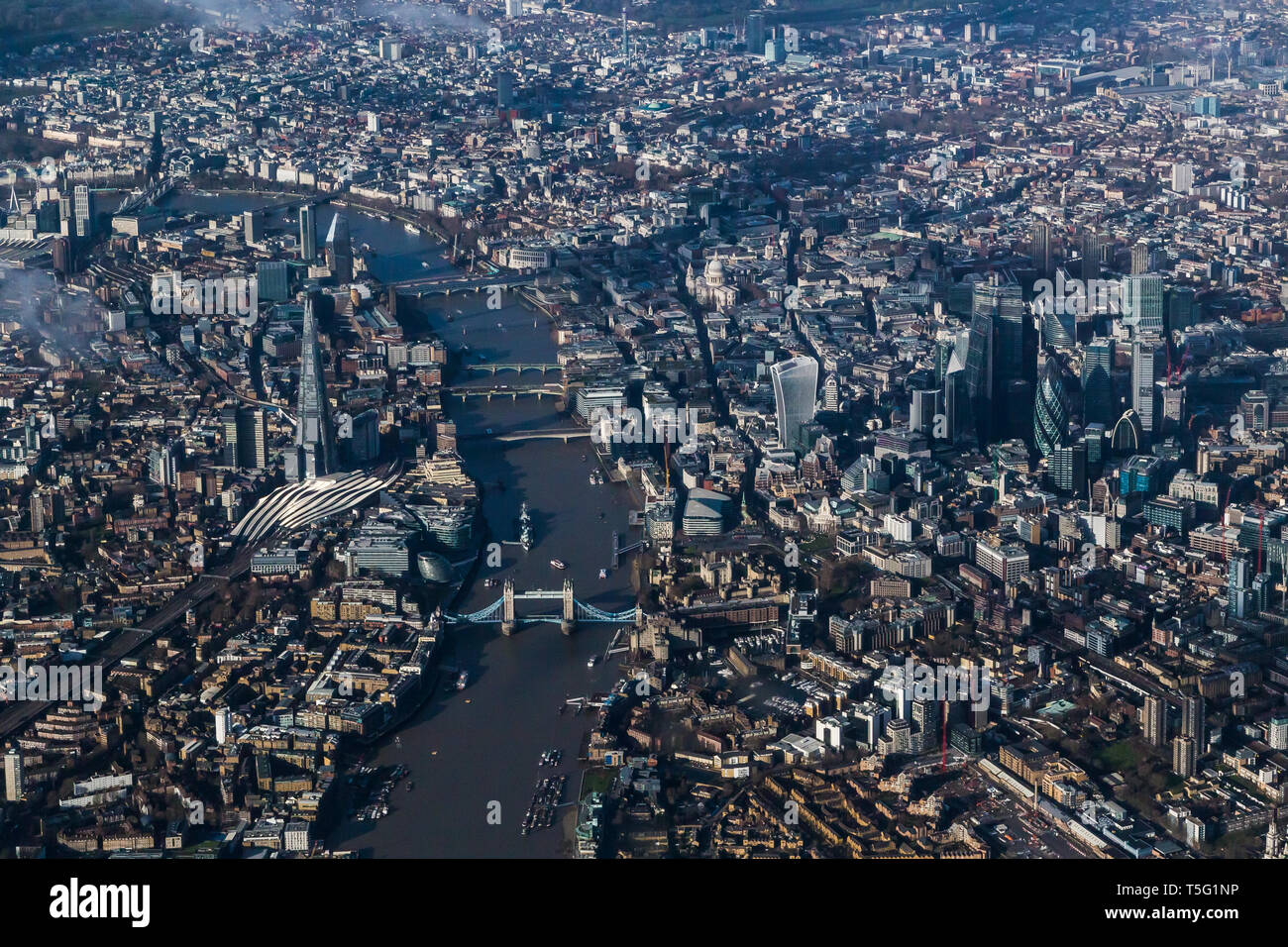 Aerial view of the Thames looking west towards Tower Bridge, the Shard and central London Stock Photo