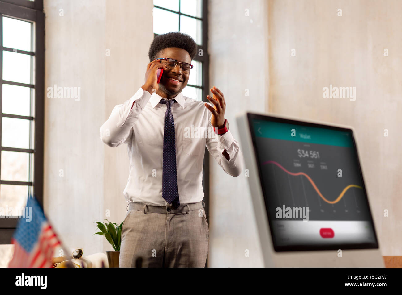 Nice African American man talking with his client on the phone Stock Photo